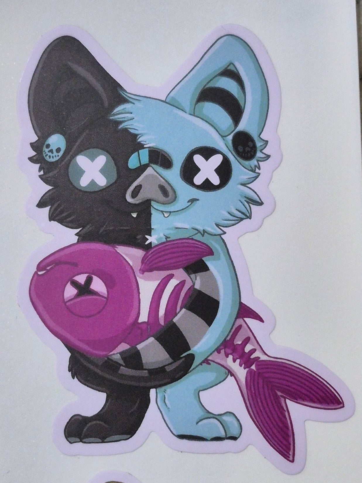 Sweet Cyanide bat holding diaphanized Fish sticker